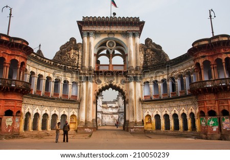 AYODHYA, INDIA - JAN 27: People stopped past historic indian gates with arches in ancient city on January 27 2013 in Uttar Pradesh. Ayodhya, with a population of 49,593 is birthplace of Lord Rama