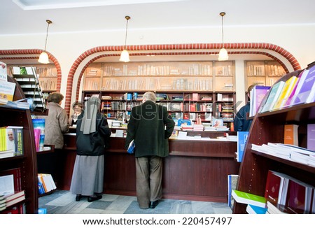 WROCLAW, POLAND - MAY 19: Elderly people choosing a book in the bookstore of the catholic community on May 19, 2014. Population of Wroclaw is 633,000, and it is the 4th largest city in Poland