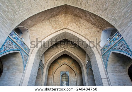 ISFAHAN, IRAN - OCT 16: Brick arched entrance of the historic mosque on October 16, 2014 in Middle East. Third largest city in Iran, Isfahan is example of Islamic culture