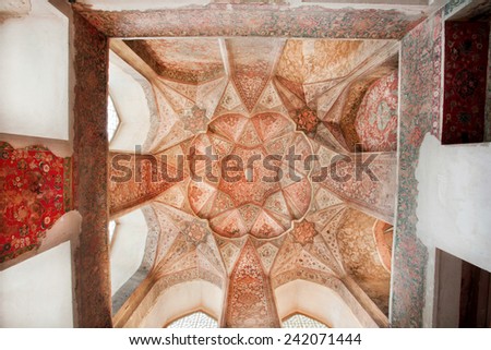 ISFAHAN, IRAN - OCT 16: Persian patterns on the ceiling of Persian palace Hasht Behesht with historical artworks on October 16, 2014. Safavid era \