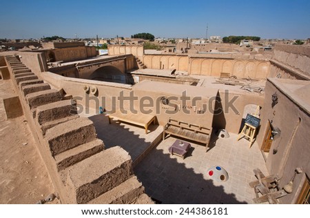 YAZD, IRAN - OCT 20: Top view on outdoor cafe in courtyard of old house in historical desert town on October 20, 2014. With population of 1,100,000 people, Yazd is the centre of Persian architecture