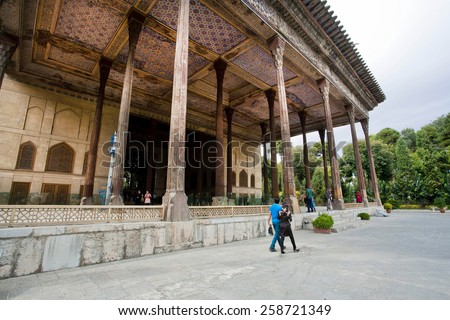 ISFAHAN, IRAN - OCT 15: People walk past the 17 century Hasht-Behesht (The Palace of Eight Paradises) on October 15 2014. Third largest city in Iran, Isfahan is the great example of Islamic culture