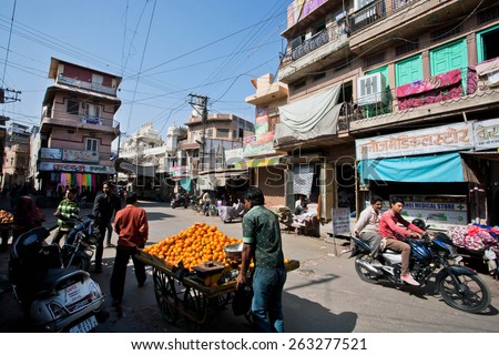 JODHPUR, INDIA - JAN 28: Street cart with tangerines driven by fruit vendors of the old townon January 28, 2015. Jodhpur with population 1,290000 people, is center of Marwar region of India