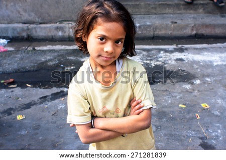 KOLKATA, INDIA - JAN 17: Unidentified child looks calm and happy on January 17, 2012 in West Bengal. Kolkata\'s literacy rate of 87.14% exceeds the all-India average of 74%.