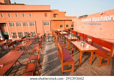 JAIPUR, INDIA - FEB 21: Cheap furniture on roof terrace of popular, but poor vegetarian restaurant in indian city on February 21, 2015. Jaipur, with population 6,664000, is a capital of Rajasthan