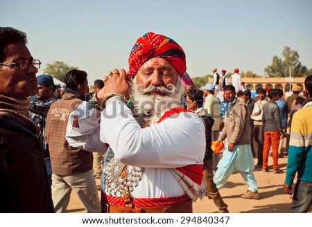 JAISALMER, INDIA - Feb 1: Brave senior man with white beard and mustache going to Mr. Desert beauty competition at the Desert Festival on February 1, 2015. Every winter Jaisalmer takes Desert Festival