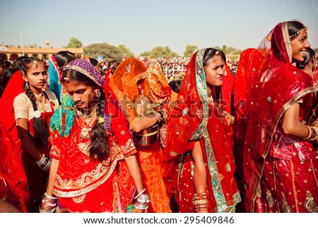 JAISALMER, INDIA - MAR 1: Many faces of indian women in the colorful crowd of the rural Desert Festival on March 1, 2015 in Rajasthan. Every winter Jaisalmer takes the Desert Festival