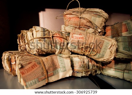 Selective focus on bundles of vintage turkish banknotes in the vault of an old bank