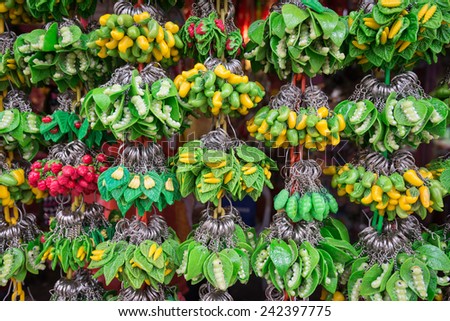 key chains of plastic fruits and animals in souvenir shop