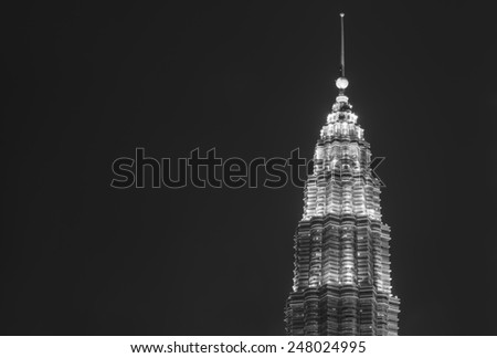 KUALA LUMPUR, MALAYSIA - DECEMBER 31, 2014: a Single Tower of Petronas Twin Towers in Kuala Lumpur, Malaysia.The Twin Towers were the tallest buildings in the world until 2004 in black and white