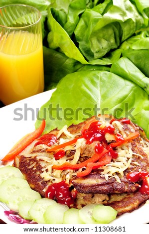 potato cake with meal and vegetables