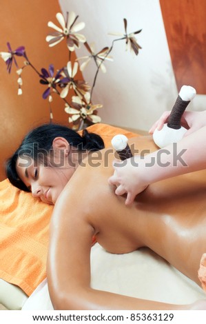 Woman getting massage in spa salon