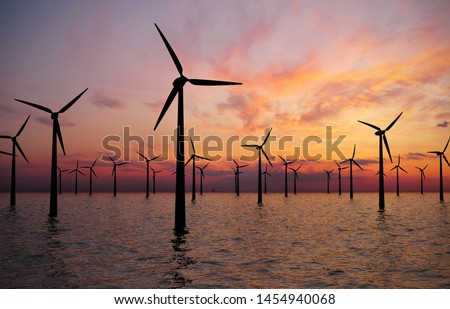 Offshore Wind Turbines Farm At sunset Foto d'archivio © 