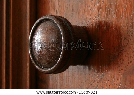 The warmth of a single wood knob from a piece of antique furniture.