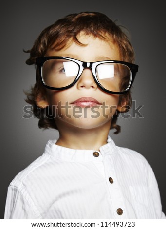 Little Caucasian Boy With Black Glasses On Grey Background Stock Photo ...