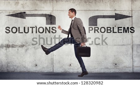 Happy businessman walking to the solutions. Grunge background / Young businessman going to the solutions