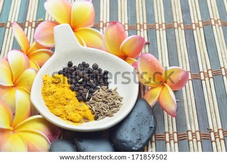 flower, zen stone and different spices on former Ceramics