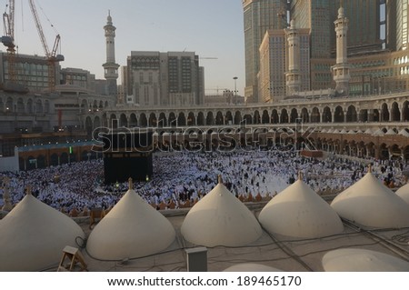 MECCA, SAUDI ARABIA - MAY 31: Muslim pilgrims, from all around the World, revolving around the Kaaba on May 31, 2013 in Mecca, Saudi Arabia. Sunrise or Morning day