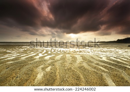Yellow sand texture and moving clouds in evening