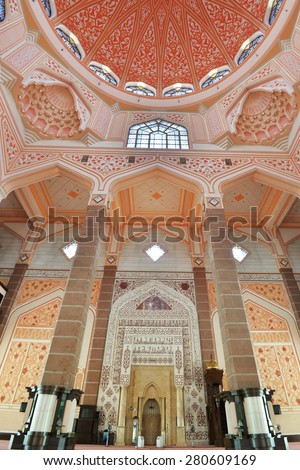 PUTRAJAYA, MALAYSIA - MAY 20, 2015: Inside the Putra Mosque, It is constructed with rose-tinted granite and located in a popular touristic and administrative location