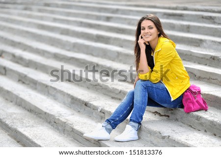 Fashionable girl in bright clothes outdoor portrait