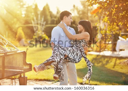 Outdoor portrait of young sensual couple in summer