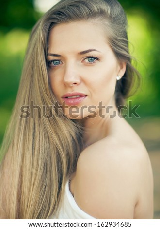 Portrait of beautiful young girl with clean skin on pretty face