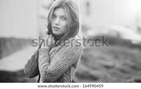 Young sensual female outdoor portrait. Black-white photo
