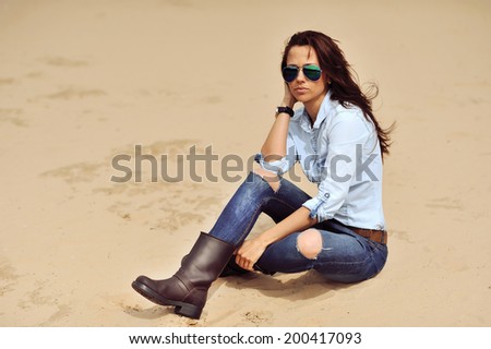 Stylish brunette woman outdoor portrait