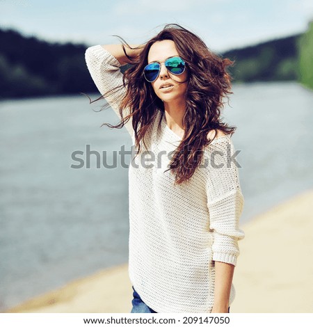 Sensual brunette woman outdoor fashion portrait