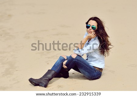 Fashion portrait of a beautiful young woman outdoor