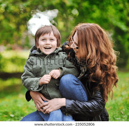 Happy mother and son in a park