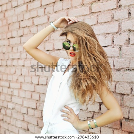 Portrait of trendy hipster girl in sunglasses