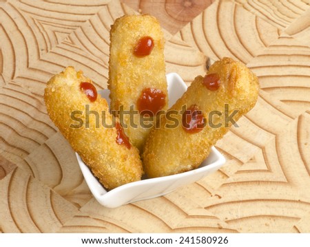 Fish and chicken fingers with sauce