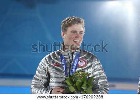 SOCHI, RUSSIA- February 13th: skier Gus Kenworthy accepts his silver medal at the Olympic park  on February 13th 2014 in Sochi Russia.