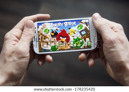 HILVERSUM, NETHERLANDS - FEBRUARY 23, 2014: Angry Birds is a video game by Finnish game developer Rovio Entertainment first released for iOS in 2009. It sold over 2 billion copies across all platforms