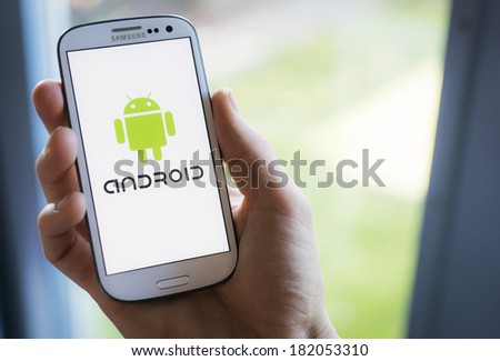 HILVERSUM, NETHERLANDS - MARCH 17, 2014: Android is an operating system based on the Linux kernel and designed for touchscreen mobile devices. The mobile HTC Dream, was successfully released in 2008.