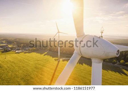 Beautiful sunset above the windmills on the field Foto d'archivio © 