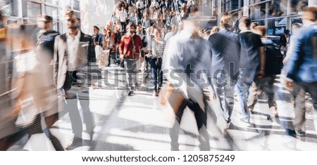 Similar – Image, Stock Photo Pedestrian crossing city downtown women walk in motion on road