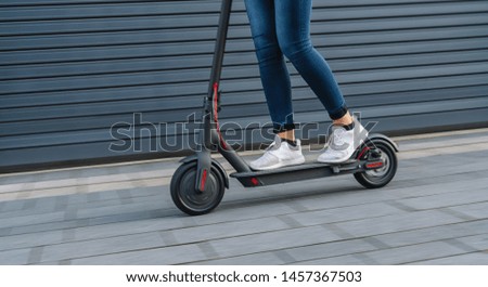 Similar – Image, Stock Photo Woman on electric kick scooter