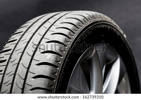 Car summer tires wheel worn profile structure on black background