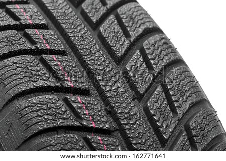 Car tires close-up Winter wheel profile structure with waterdrops on whitebackground
