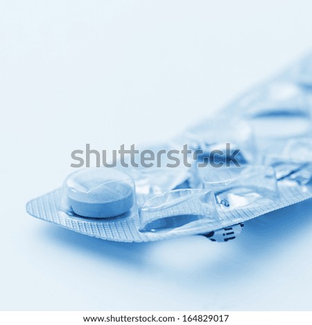 Tablets pills packaging pharmacy medicine medical on blue white background
