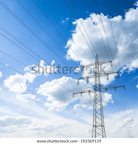 electricity pylon on blue sky with clouds power electricity