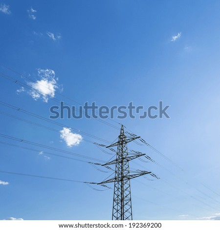 electricity Pylon on blue cloudy sky high voltage electricity production