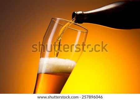 wheat beer pouring out of a bottle
