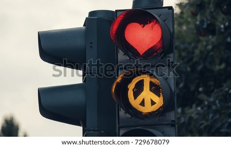 Similar – Image, Stock Photo Love and peace, traffic light with red heart and yellow peace sign. Love and peace