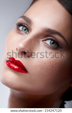 Fashion Beauty Makeup. Beautiful Woman With Red Lips and Luxury Makeup. Beautiful Face