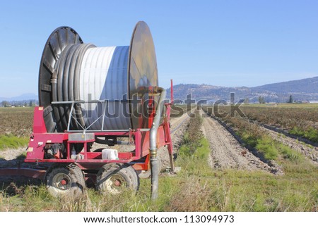 Industrial hose and reel for watering acreages/Industrial Farm Irrigation Hose/A hose and reel capable of irrigating large parcels of farm land