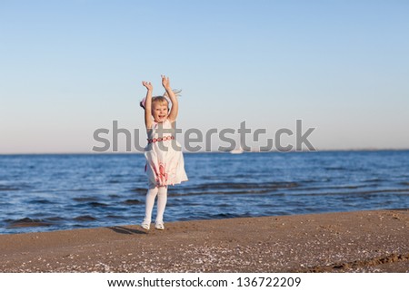 happy jumping girl near the river